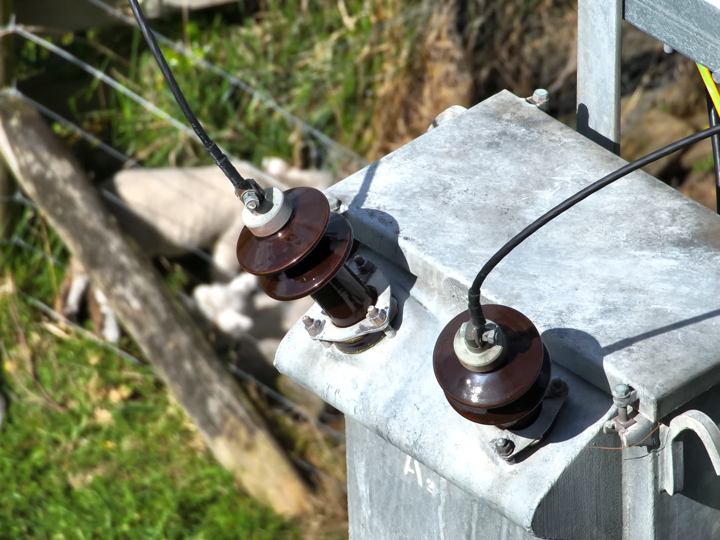 Drone inspection photo of power line hardware captured at long zoom