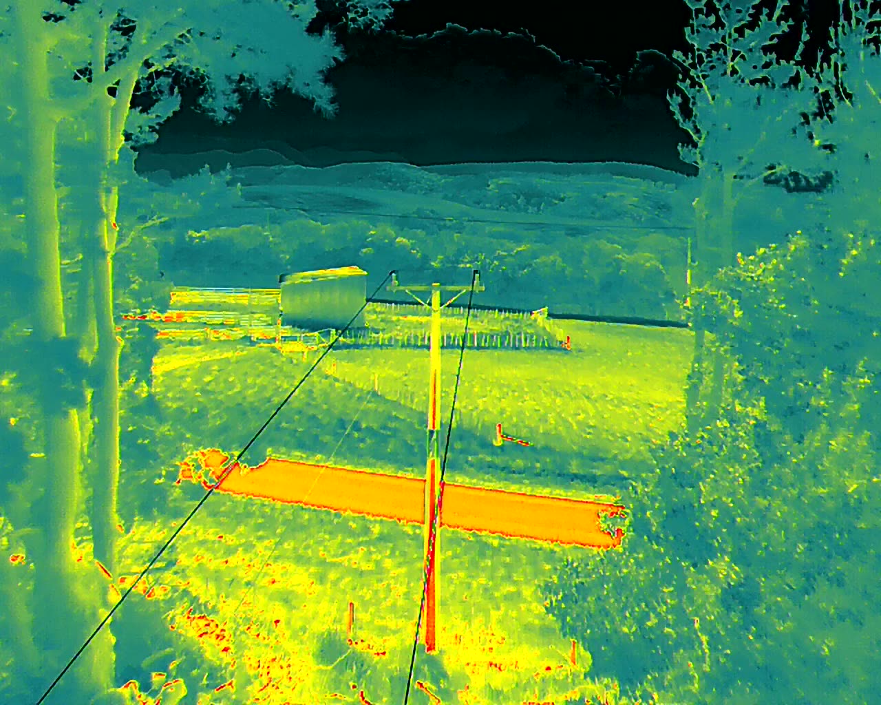Thermal image of a power pole and lines captured on a KC Drone Solutions inspection flight