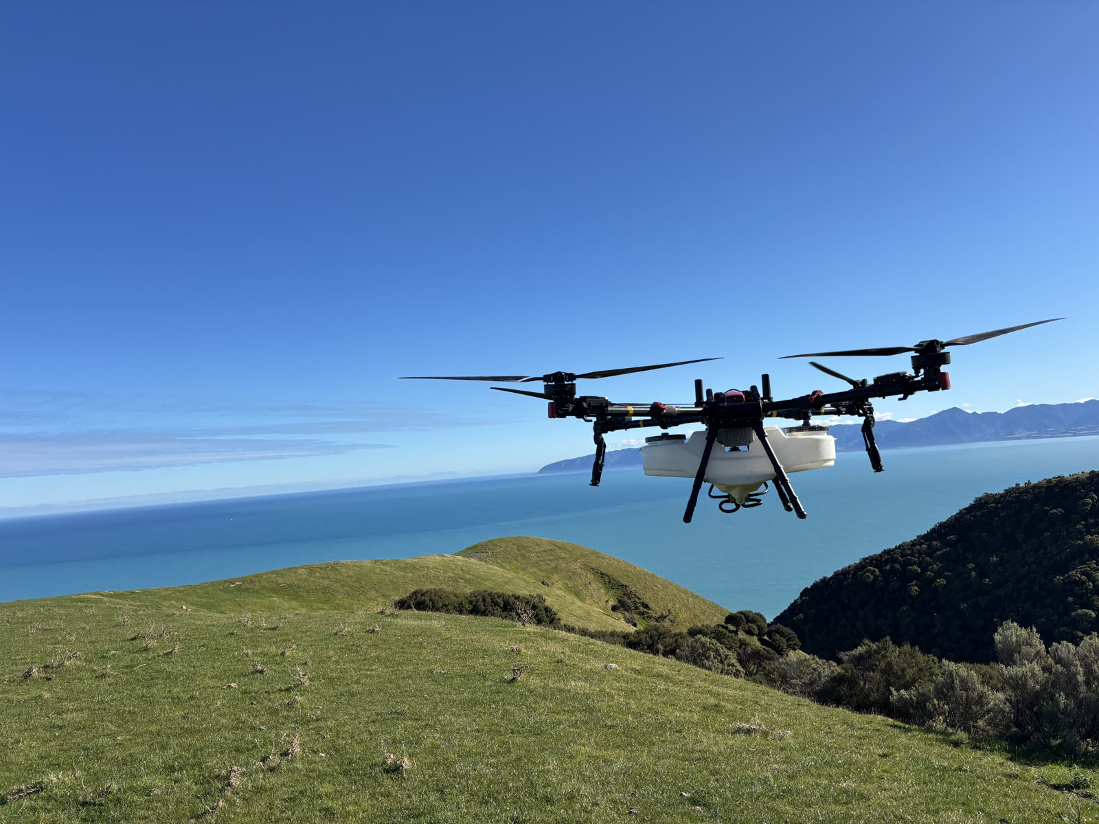 KC Drone Solutions XAG agricultural drone in flight over Wairarapa farmland